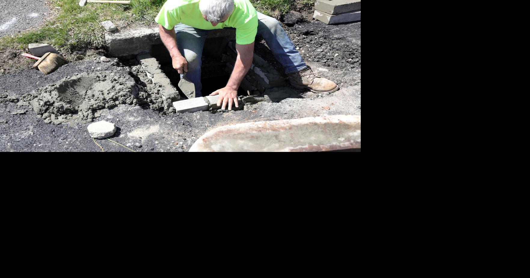 Bob O'Brien mortaring storm drain structure | | berkshireeagle.com