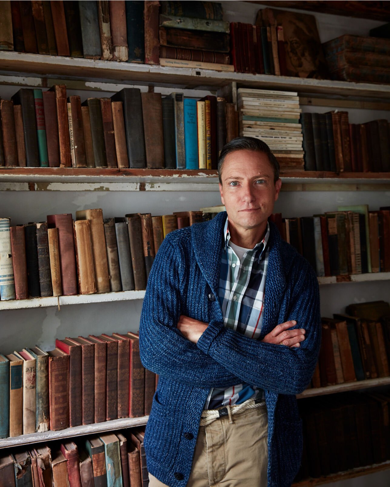 Ken Fulk in front of bookshelf