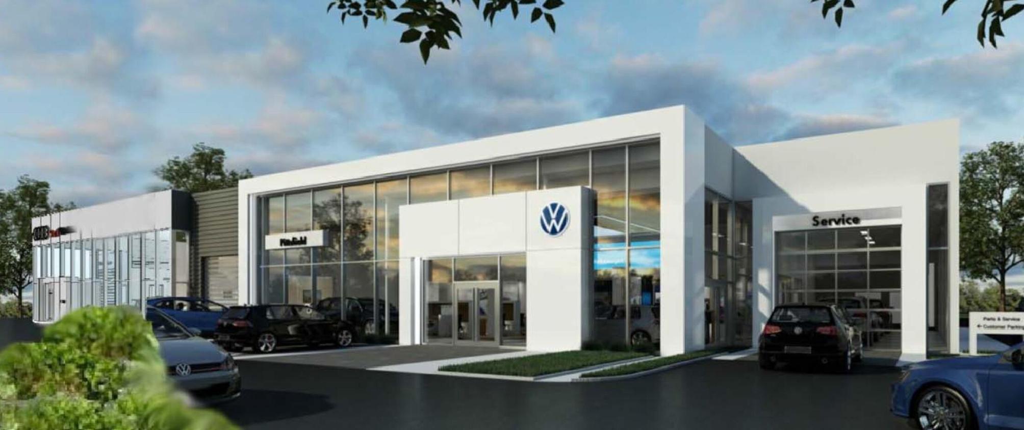 The owner of two auto dealerships has purchased the land to build a new