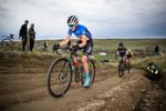 Kira Payer pedals on a dirt path