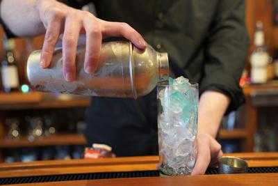 bartender pouring a drink