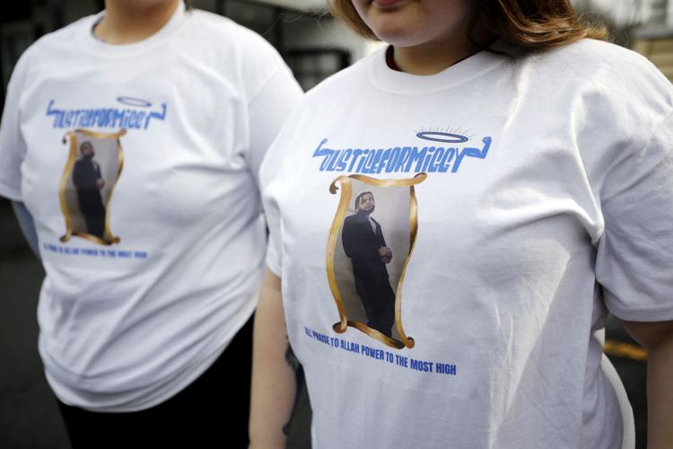 women wear justice for miggy shirts at funeral home (copy)