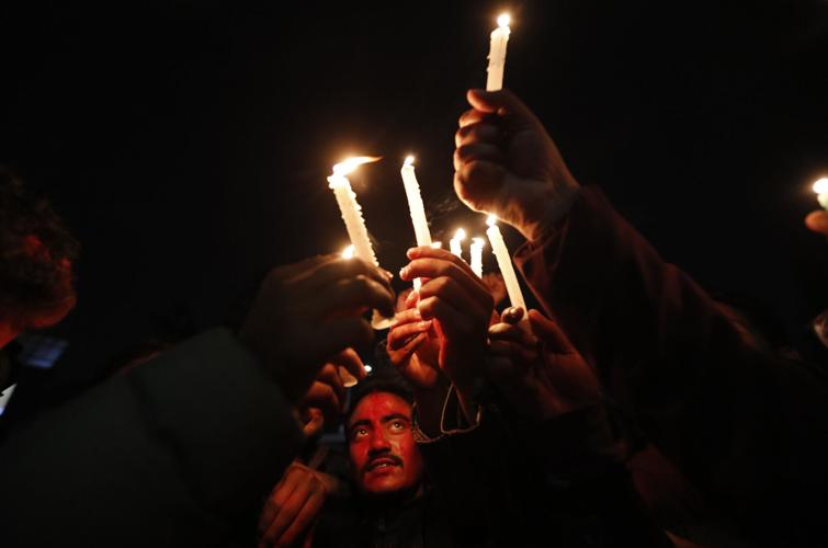 People celebrate after the reinstatement of Parliament