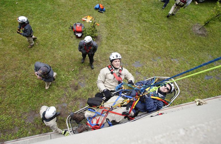 firefighters train with rescue ropes