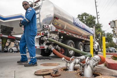 Tanker driver fills underground fuel tanks