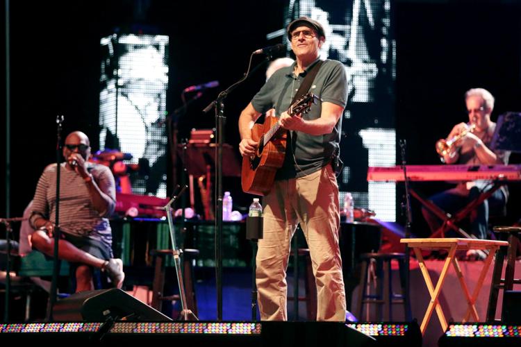 James Taylor on stage with band