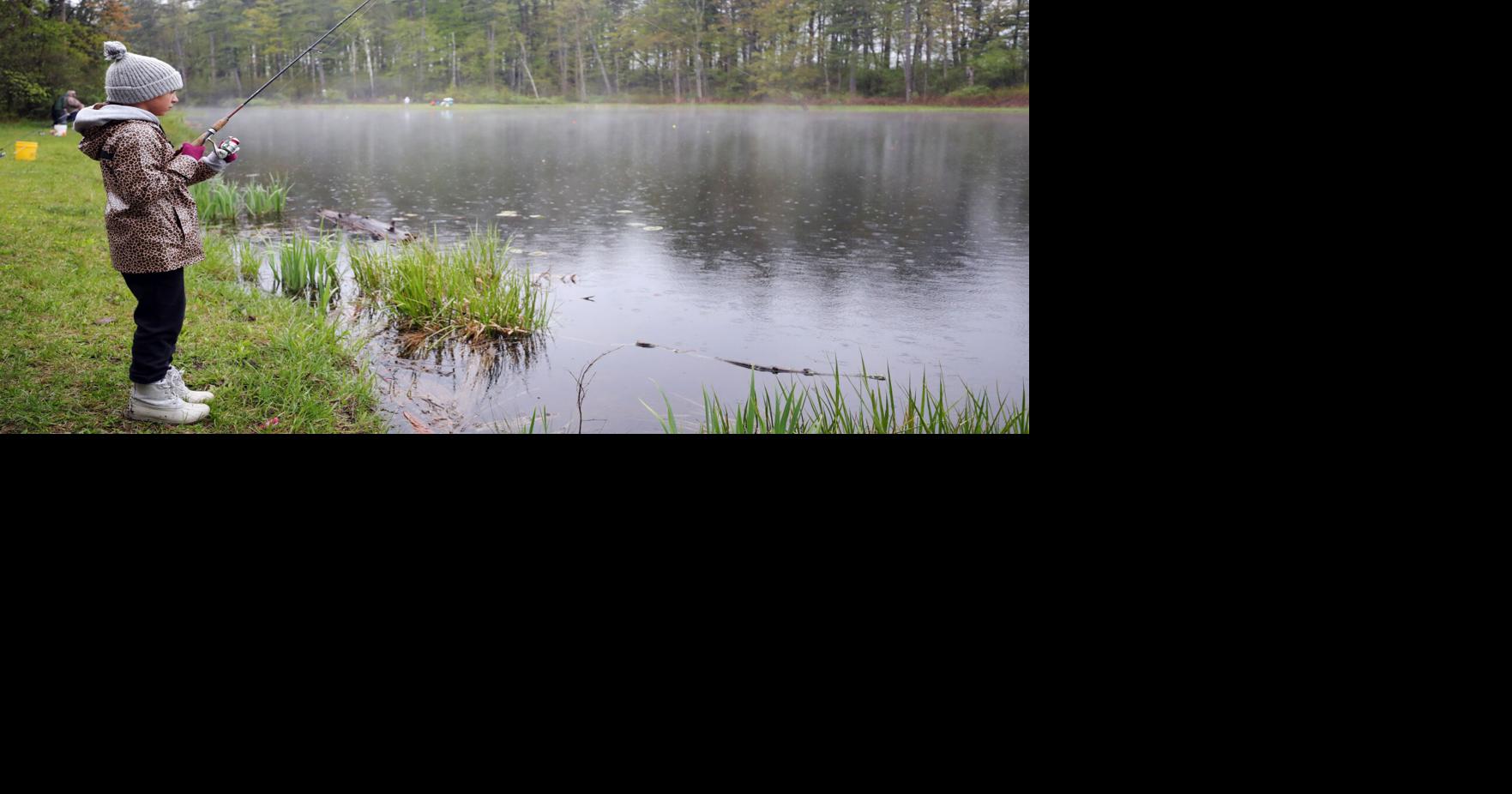 Reelin’ in the rain: Pittsfield kids brush off rain for youth fishing derby