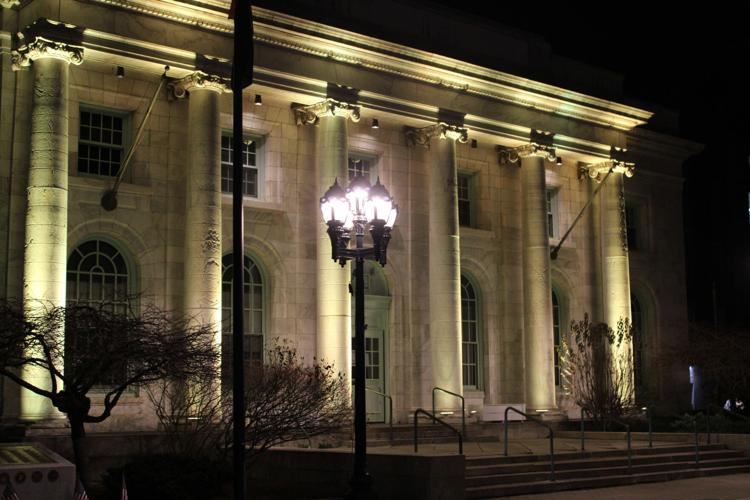 Pittsfield City Hall illuminated in yellow for World Day of Remembrance