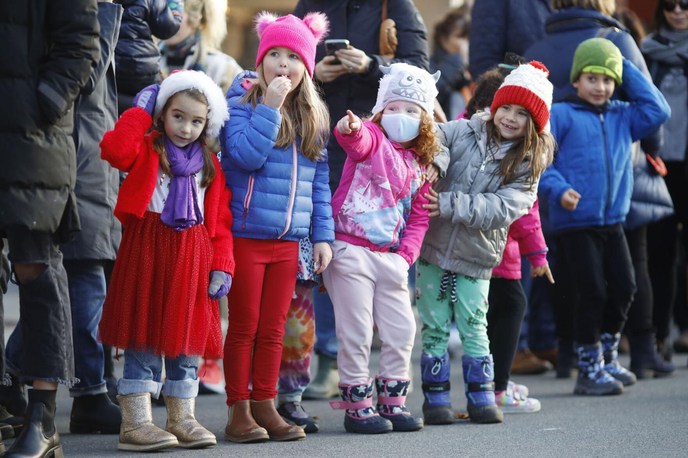 excited kids watch holiday parade