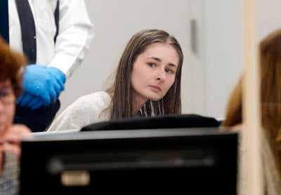 Kelsie Cote leans in court