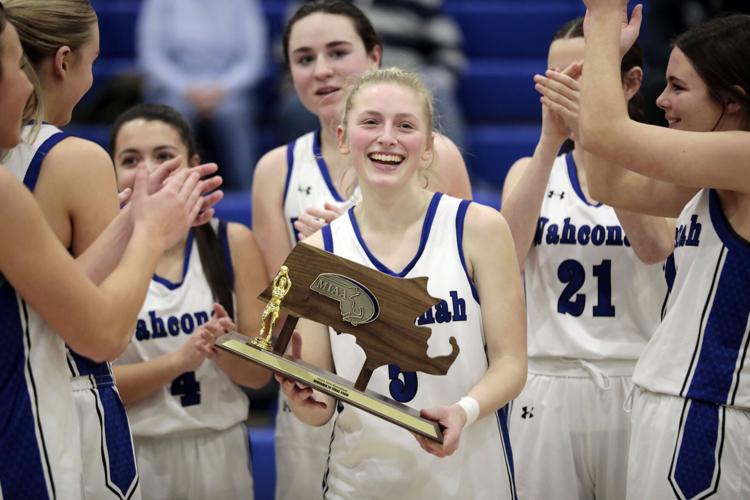 Wahconah girls basketball team holds trophy
