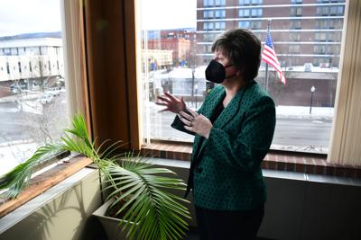Mayor Jennifer Macksey stands in the corner office looking out the window
