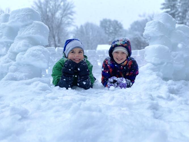 Two children in a snowfort