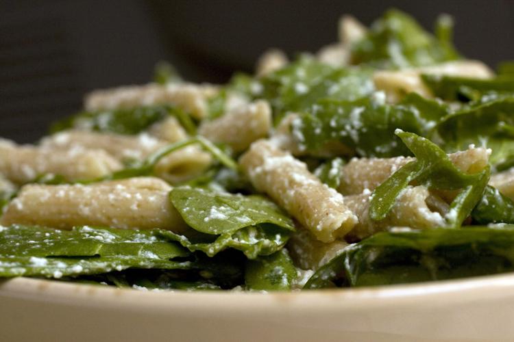 Spinach and noodles on a plate