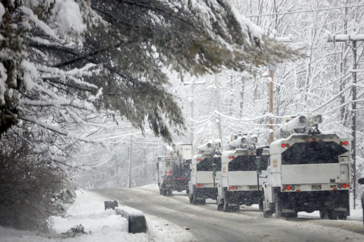 line trucks driving on snowy road (copy)