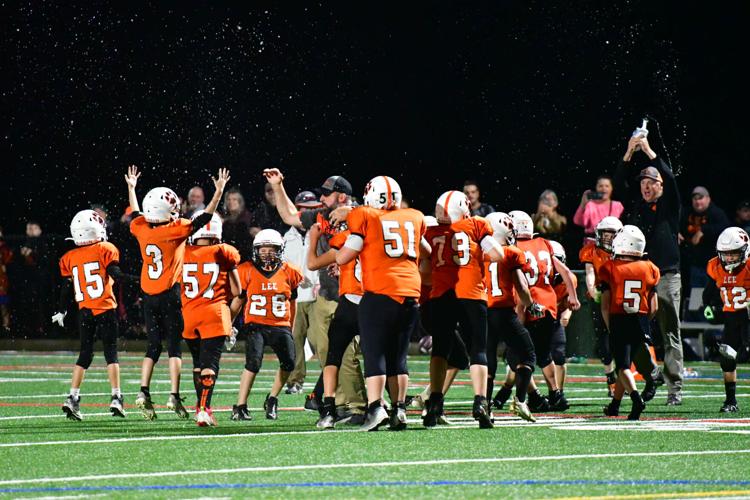 Football players celebrate their win