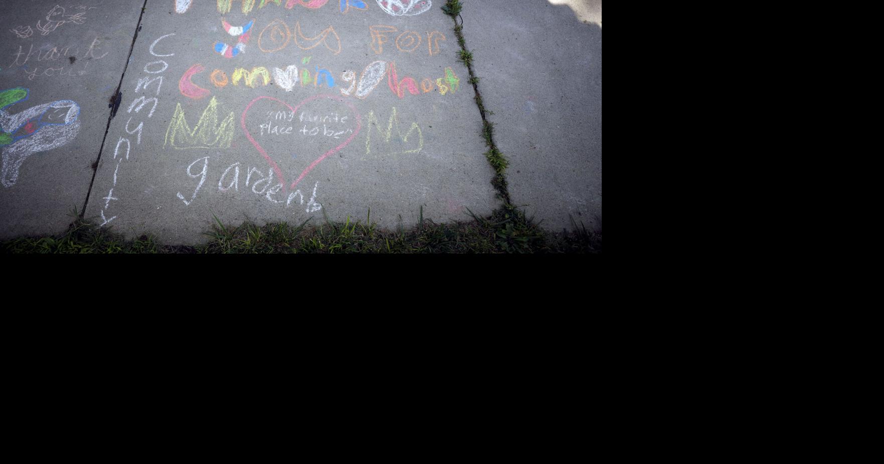 Thank you message from kids on sidewalk in chalk