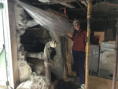 Karen Curlee stands in her basement