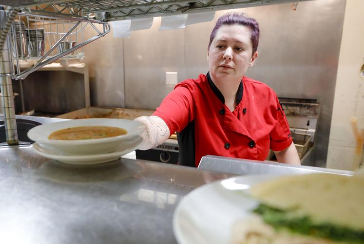 chef Karrie Gulmi places bowl of soup on order window
