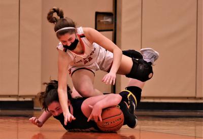 girls go after a loose ball