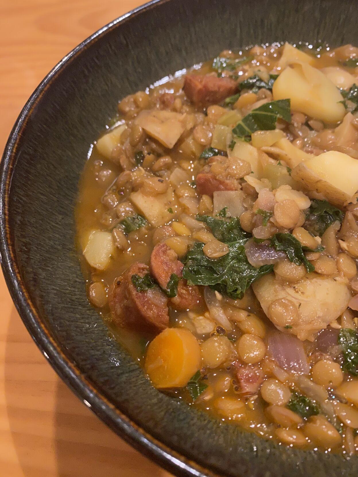 Bowl of chorizo, lentil and potato soup