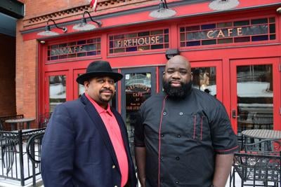 Dews and Jones pose in front of the restaurant