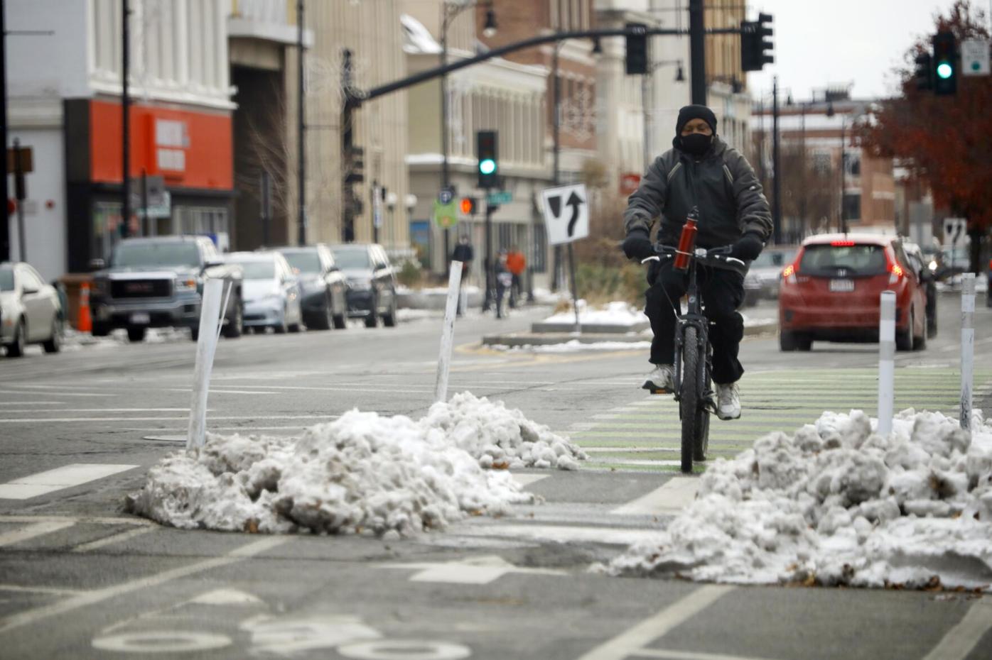 bicyclist rides in bike lane on north street (copy)