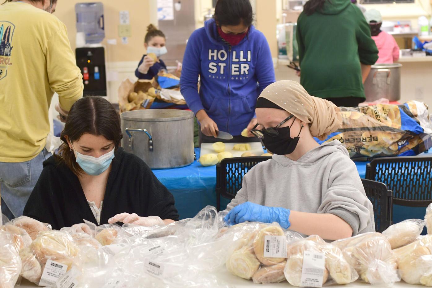 Volunteers prepare meals on wheels for Thanksgiving