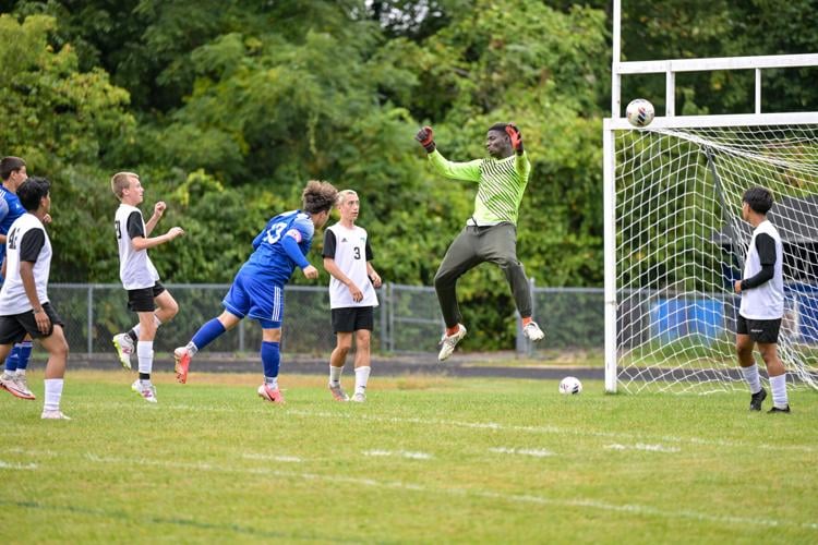 Matt Howland header past Jeremiah Asenso