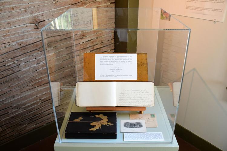 An autograph book is under glass