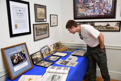 Blake looks at some historical artifacts (copy)