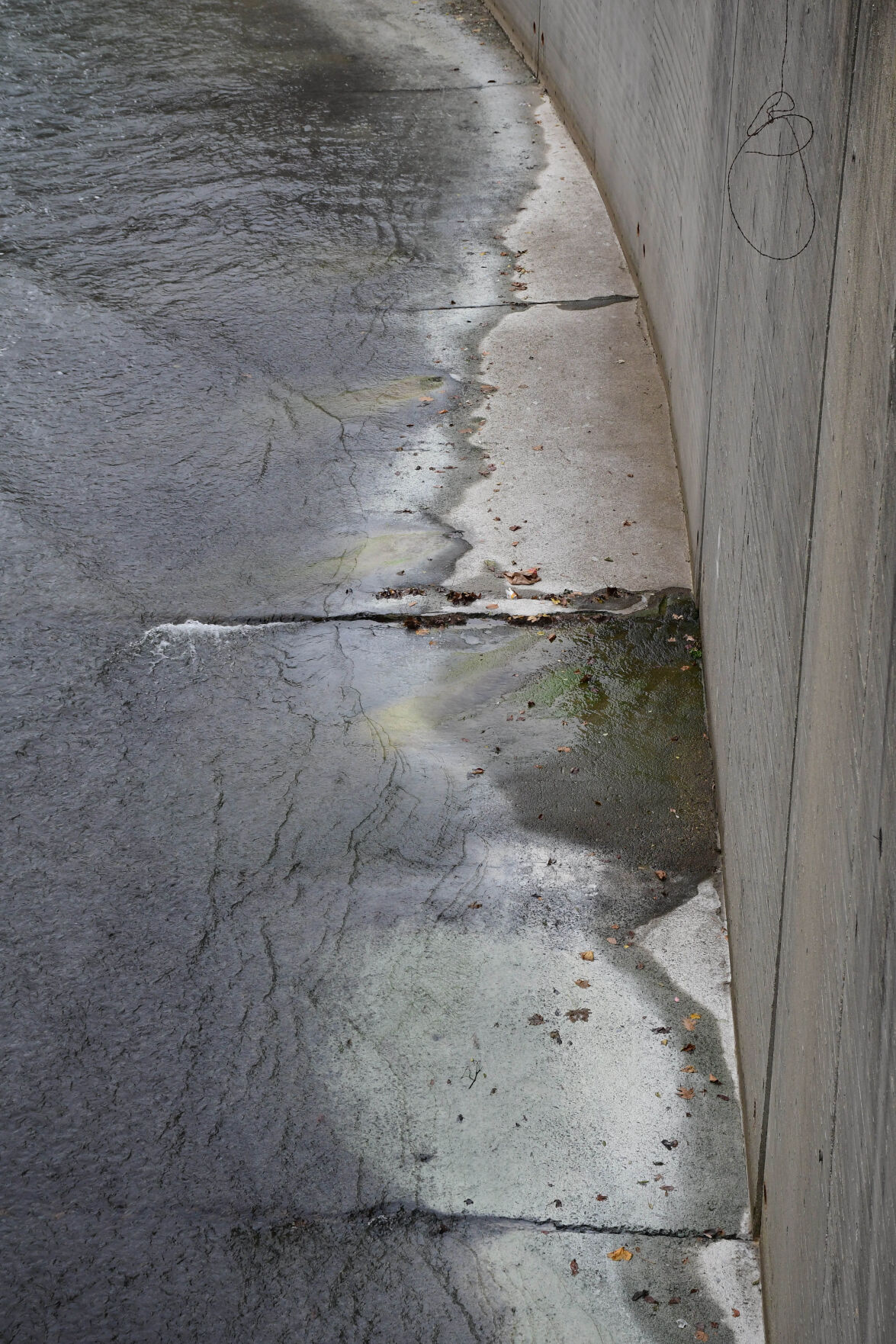 Chalky residue on the cement section of the river
