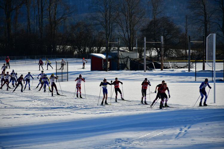 Skiers leave the start of the race