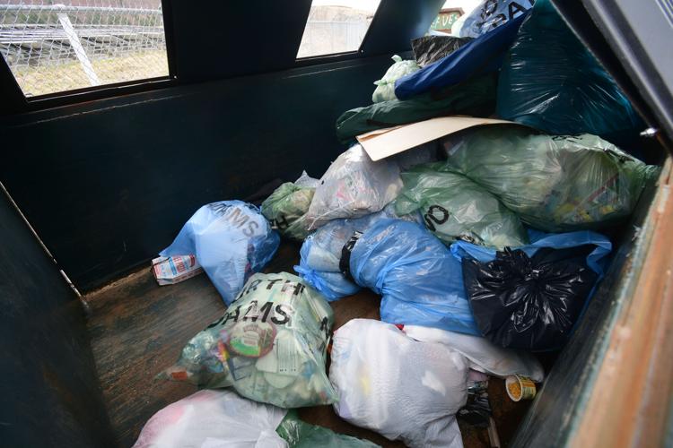 Garbage bags in one of the dumpsters at the transfer station