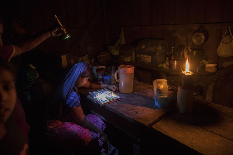 A child looks through an illustrated Bible