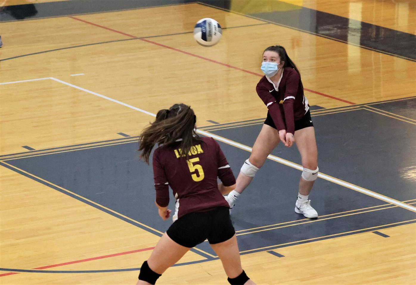 Emily Barenski digs up a ball
