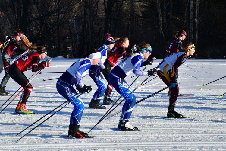 Skiers leave the start of the race