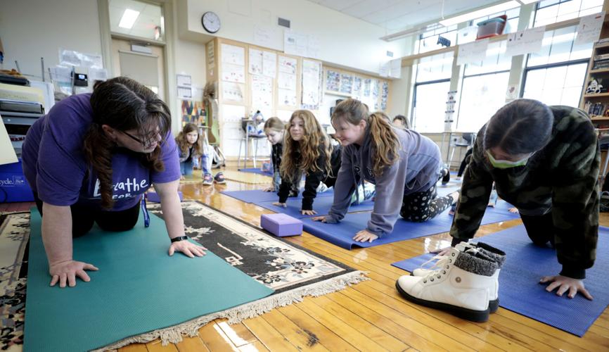 Lisa Tanner leads fourth grade yoga class