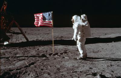 Astronaut on moon with flag