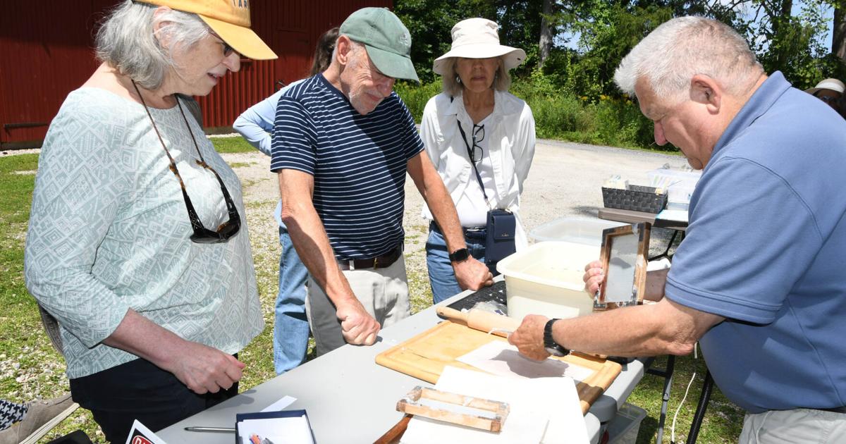 Sheets of history: Visitors enjoy the art of making paper by hand at Arrowhead