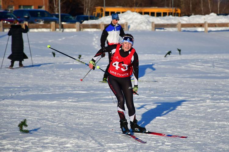 A nordic skier approaches the finish line