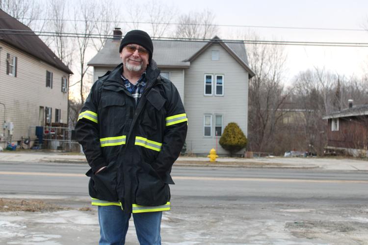 J.D. Hebert stands near the home at 1223 North St. in Pittsfield