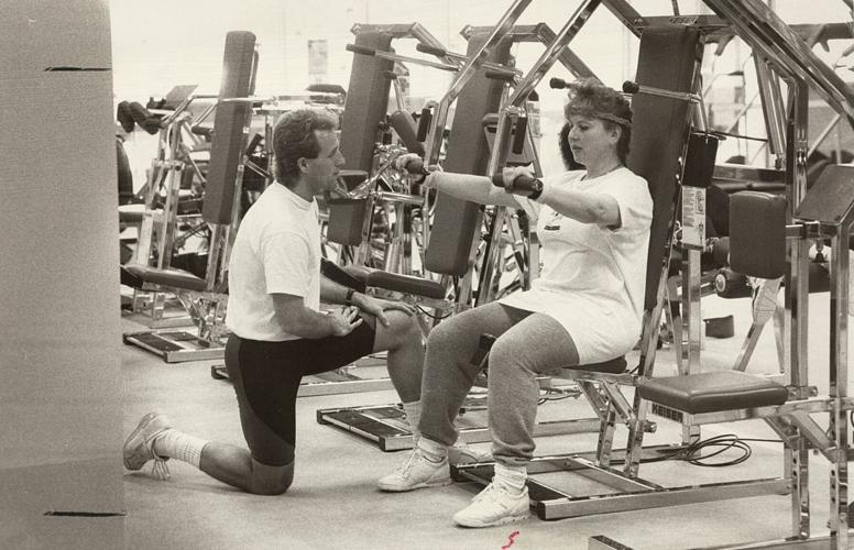 Instructor Victor Pascarella assists visitor unfamiliar with the Kaiser equipment