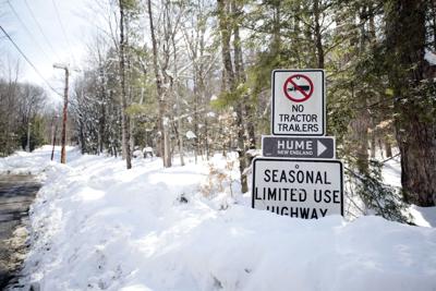 hume new england sign in snow on street