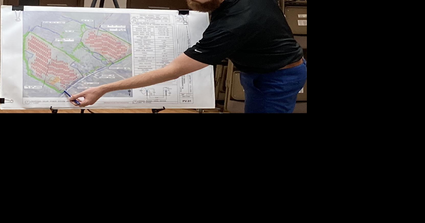 Andrew Hamel shows plans for a solar project at Square Roots Farm