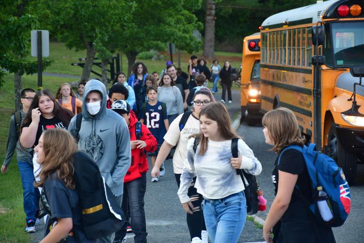 Students depart buses