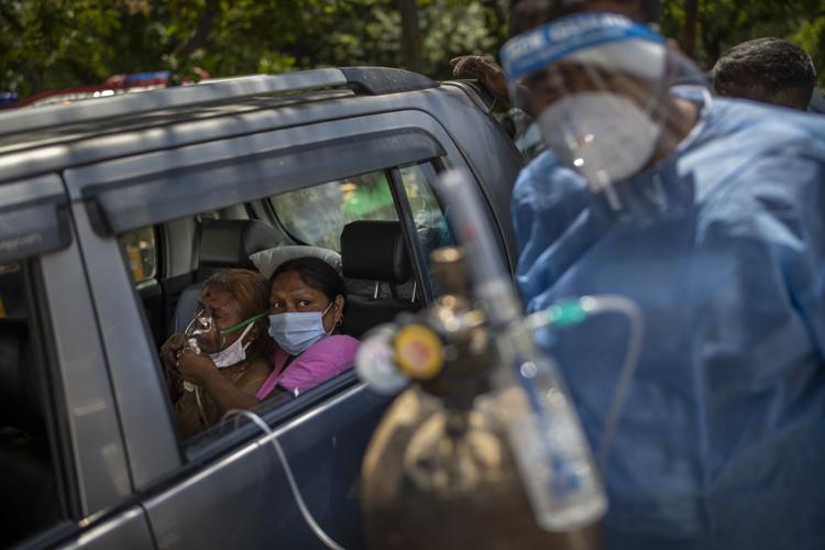 A patient in a car receives oxygen