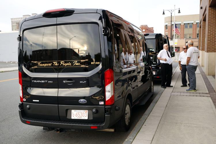 transportation vans waiting on street