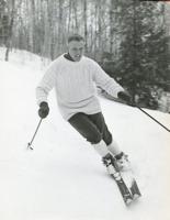 black and white photo, man skiing