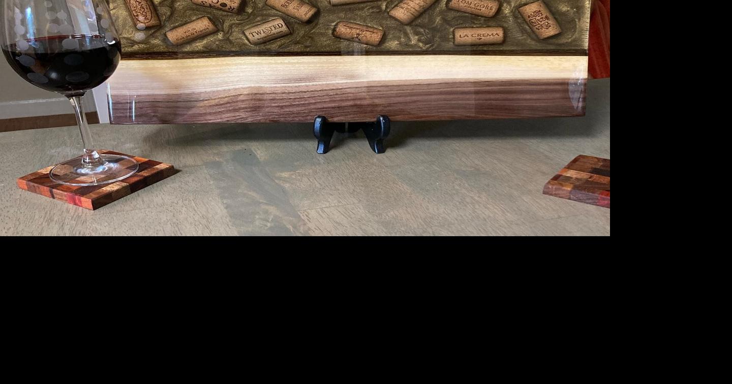 Cutting board with corks cast in resin